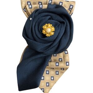 Reimagined necktie pendant with Vintage Jewelry accent. (Necklace not included)